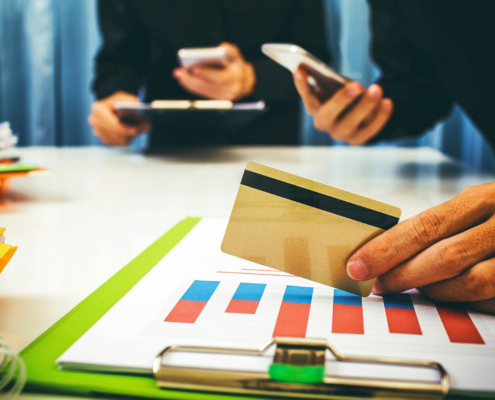 Close up view of a person holding a credit card
