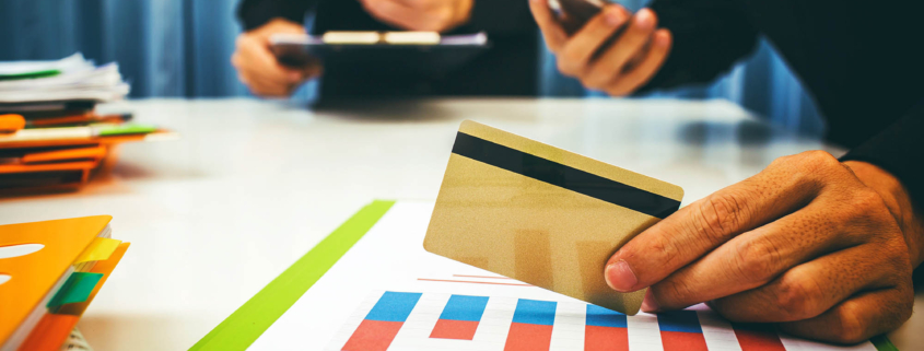 Close up view of a person holding a credit card