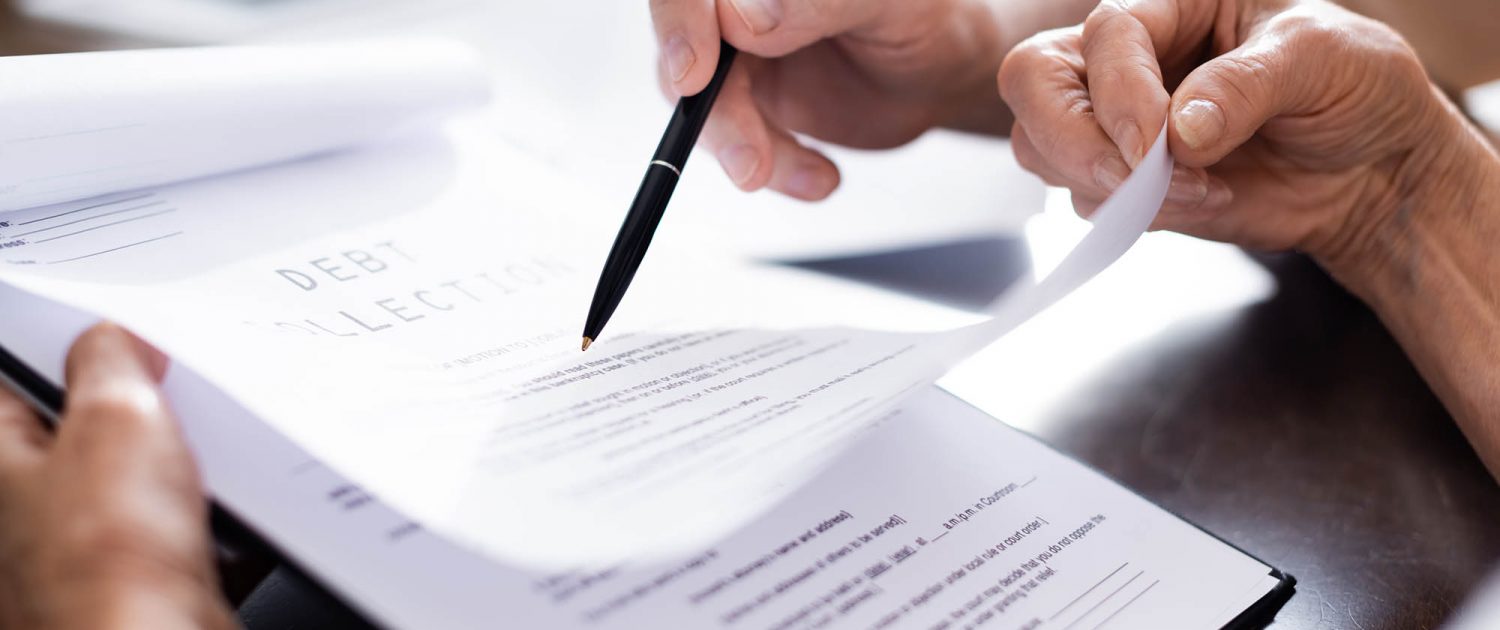Close up view of debt collection documents