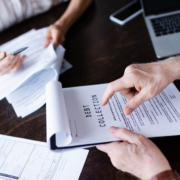 Overhead view of a debt collection clipboard