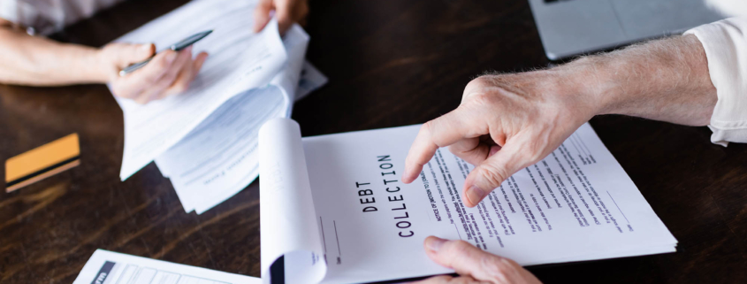 Overhead view of a debt collection clipboard