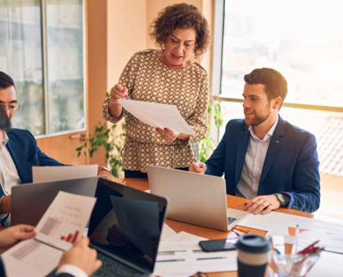 business people discussing documents in meeting