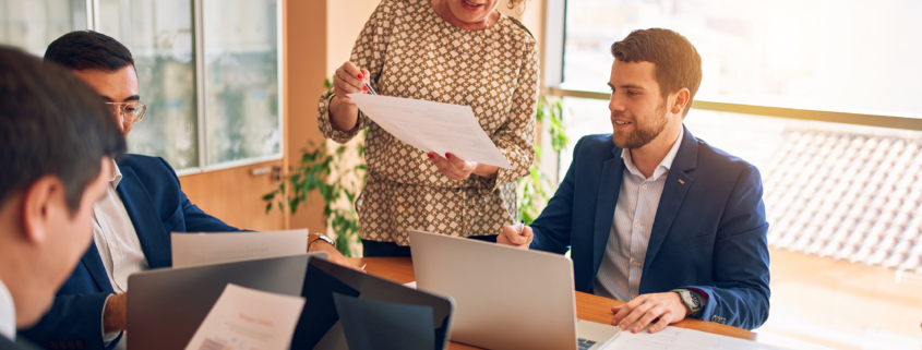 business people discussing documents in meeting