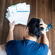 man stressed handling bills