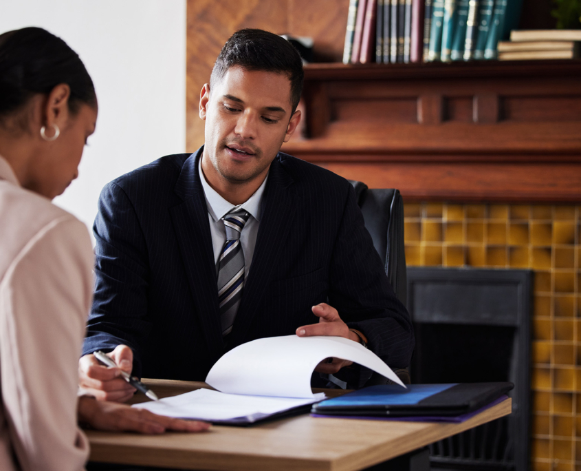 Two people looking over paperwork Two People Looking Over Paperwork