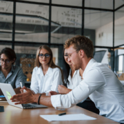People discussing finances in a meeting room