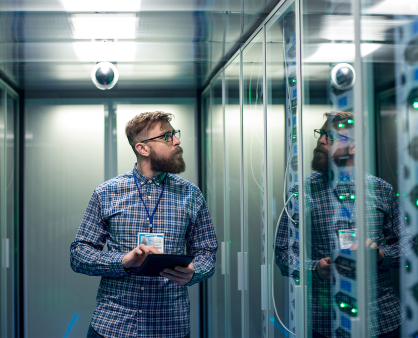 IT engineer with tablet in server room It Engineer With Tablet In Server Room