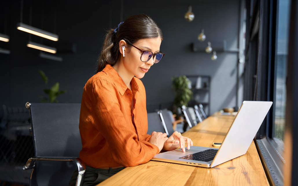 Business Woman Working On Laptop Computer At Office Desk